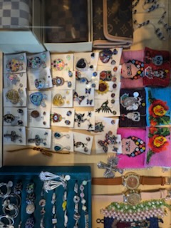 Rings and beaded bracelets arranged in display trays