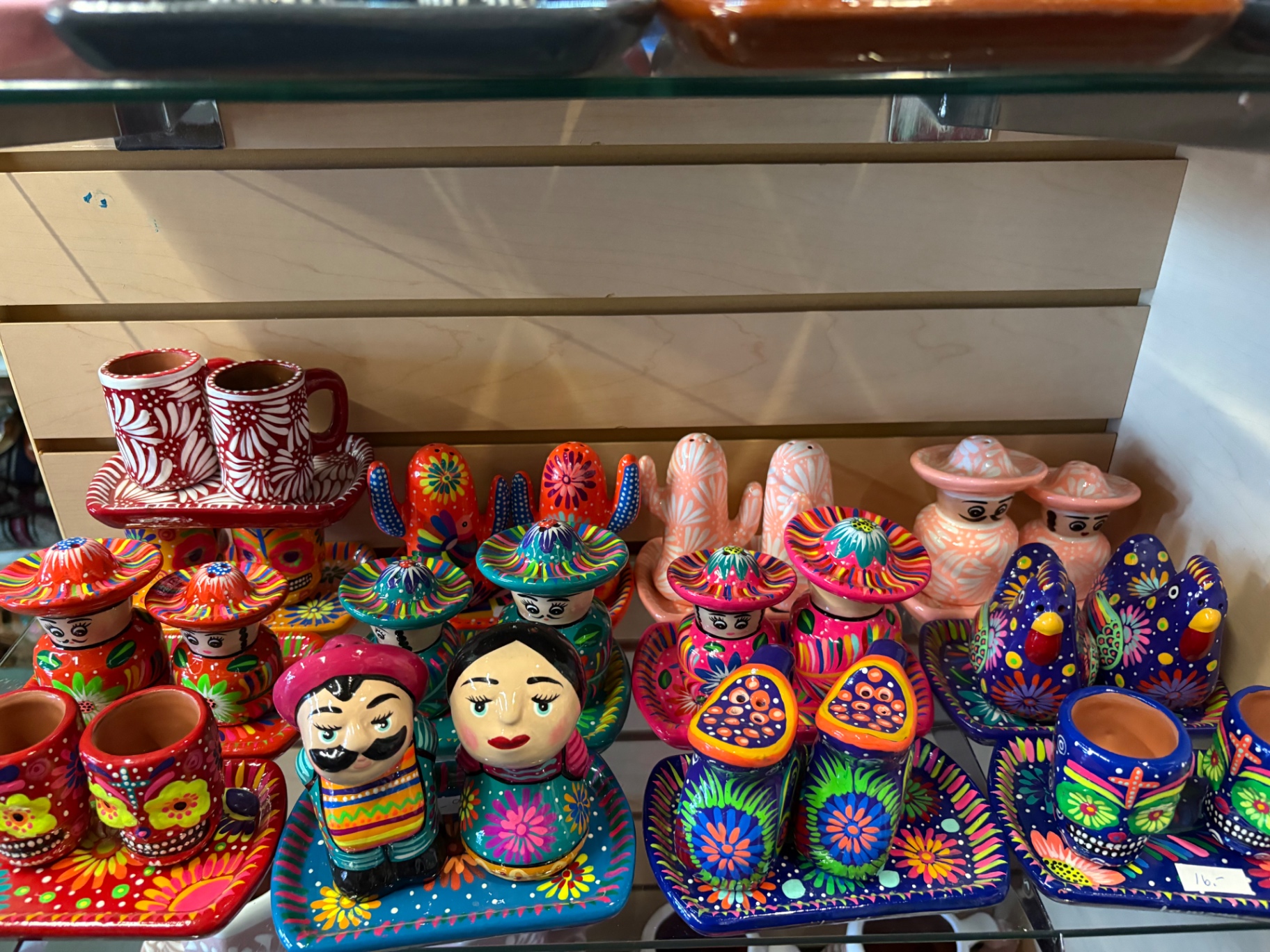 Hand-painted Talavera sombrero figures and cactus ceramics