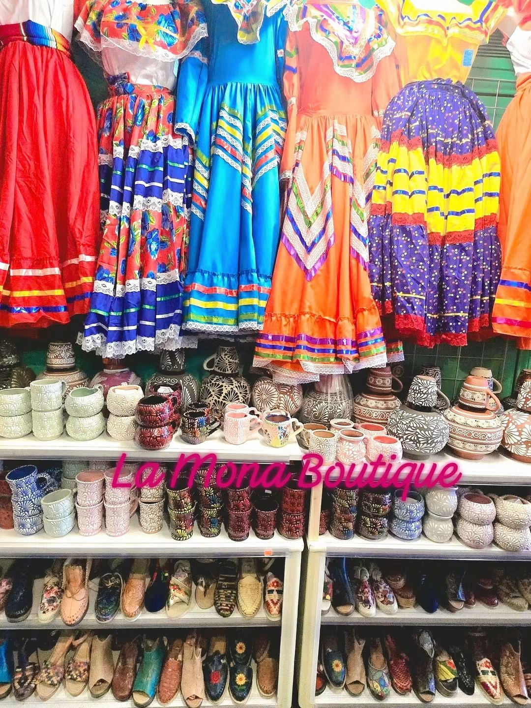 Colorful Mexican dresses, ceramics and huaraches on shop shelves