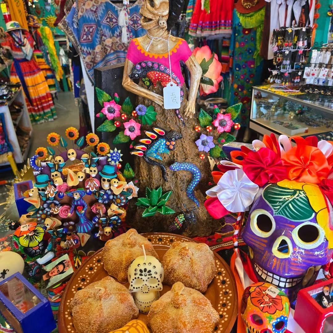 Vibrant Day of the Dead centerpiece with Catrina figure and sugar skulls